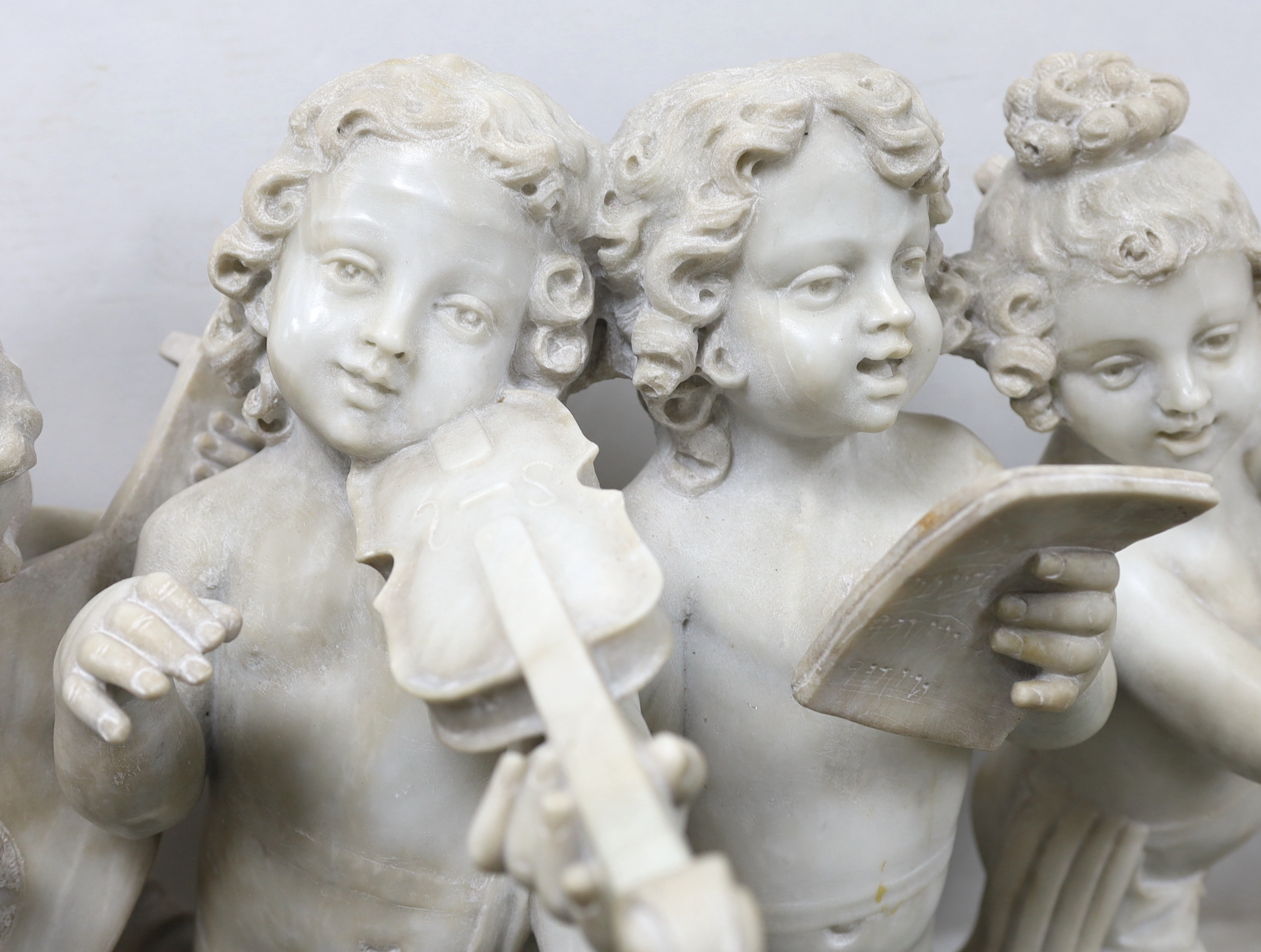 After the Ferdinando Vichi Gallery. An Italian white Carrara marble group 'Musica', Please note this lot attracts an additional import tax of 5% on the hammer price